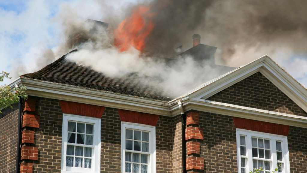 House roof engulfed in flames