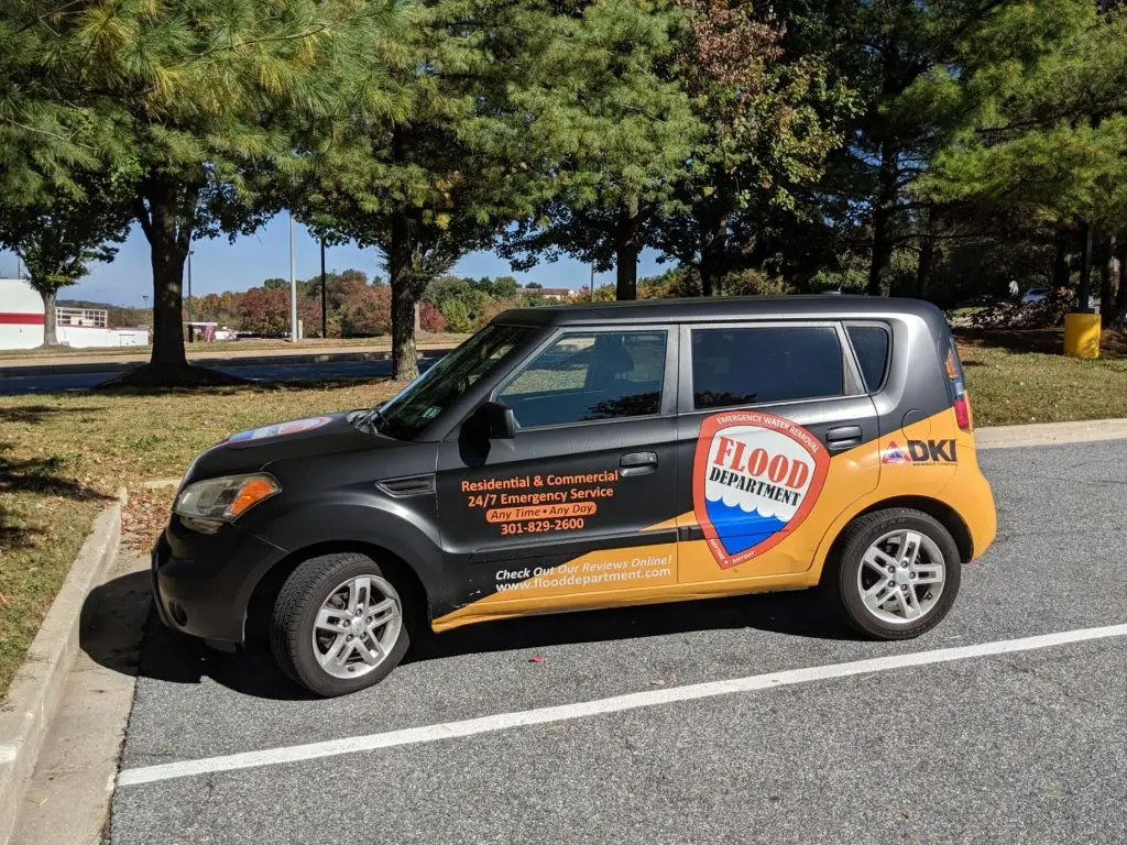 Car with flood department branding parked