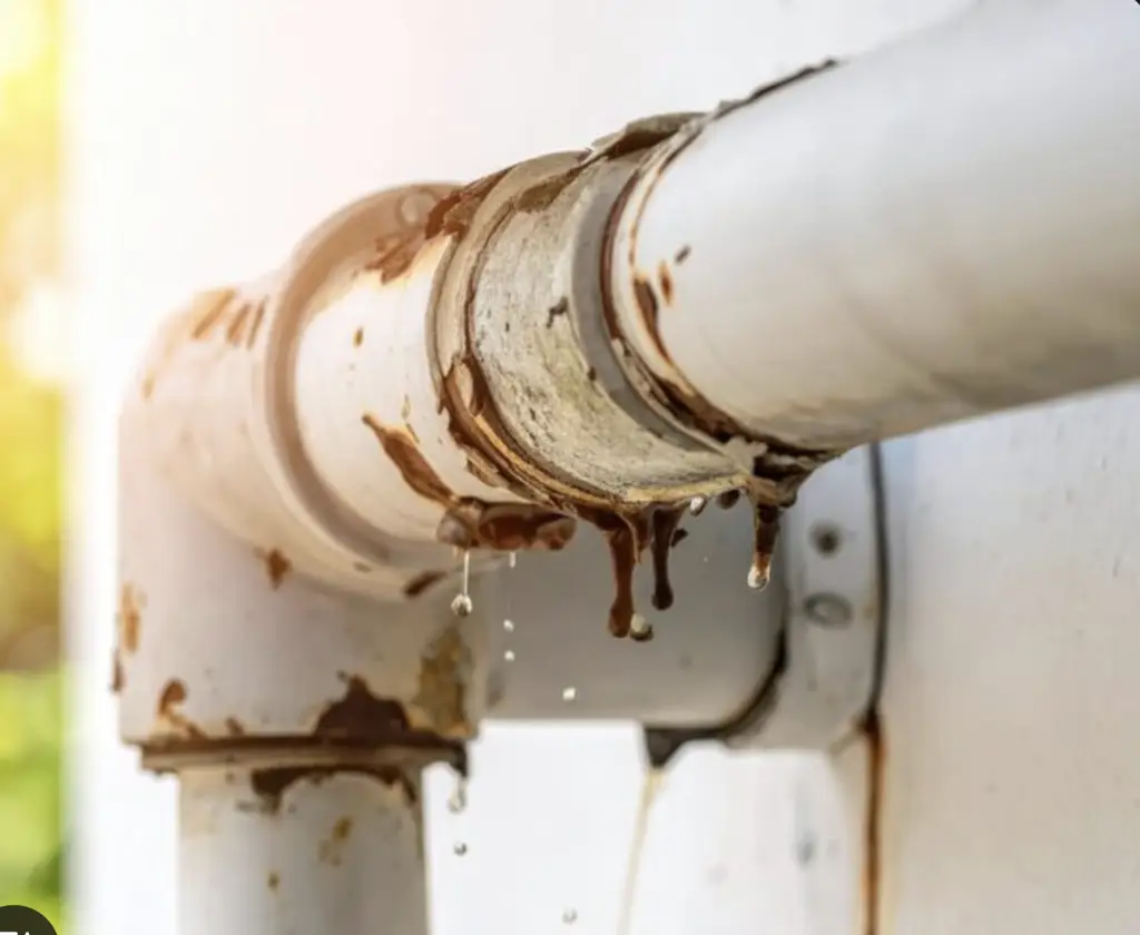 Rusty pipe with water dripping