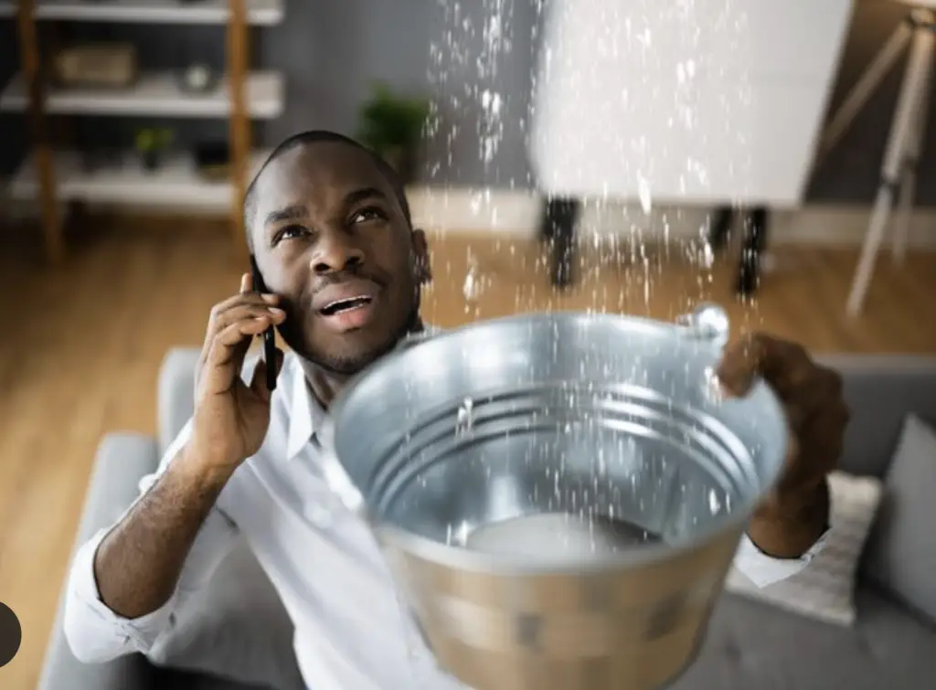 Man on phone with water leak